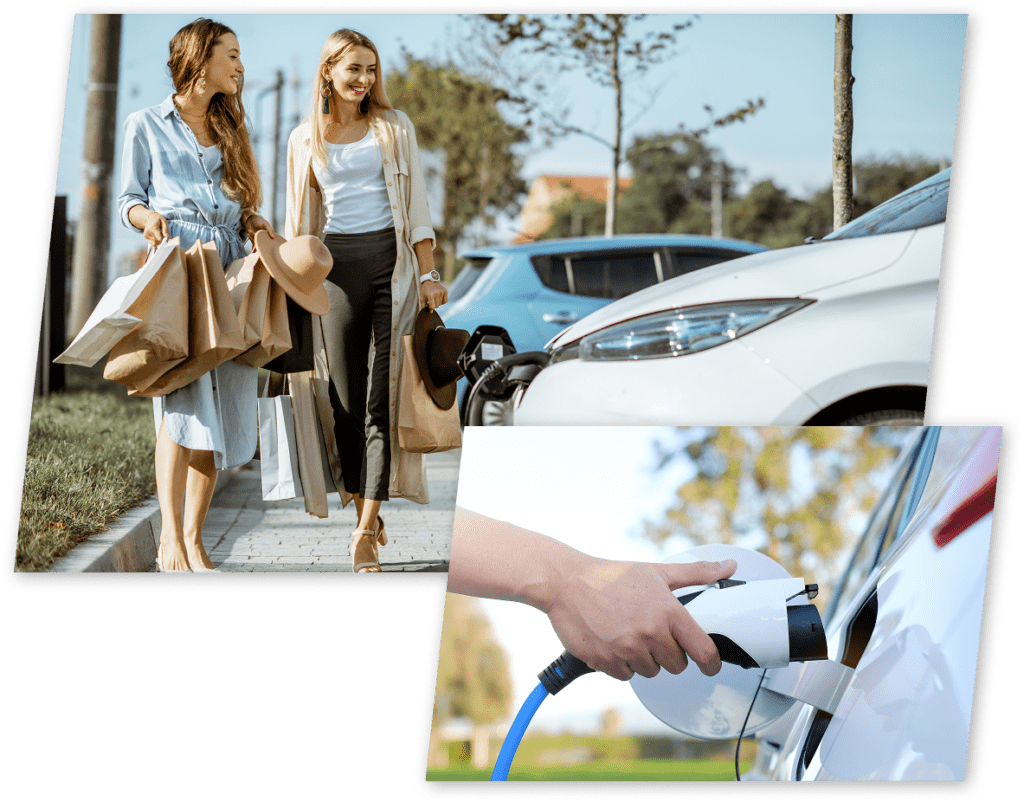 Two women walking by EV car charging.